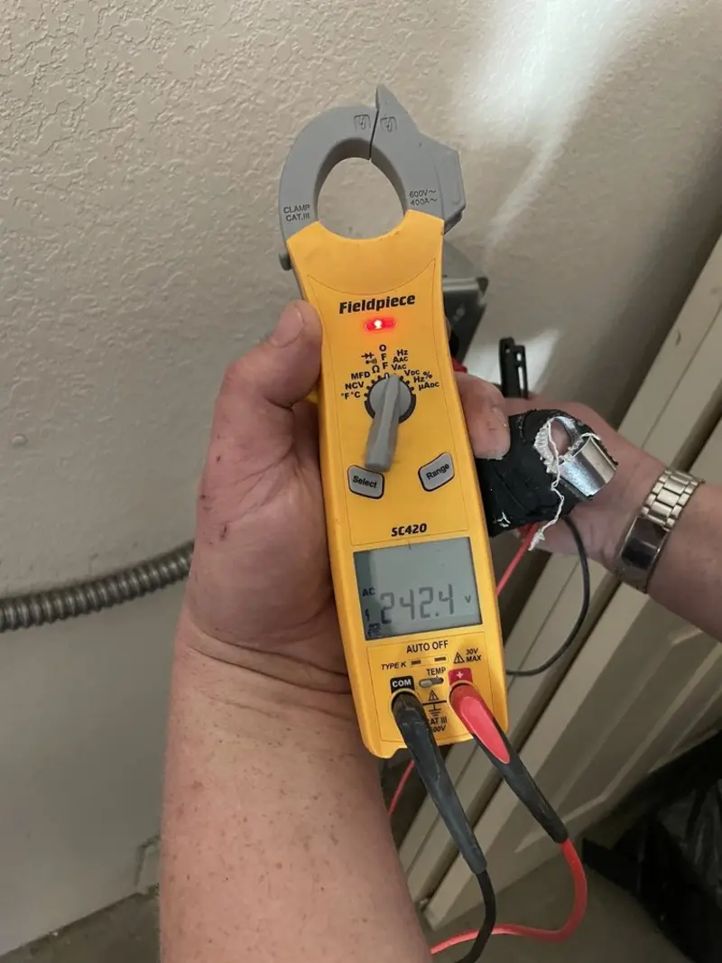 Voltage testing with clamp meter during Ceiling Fan Installation in Buckhall